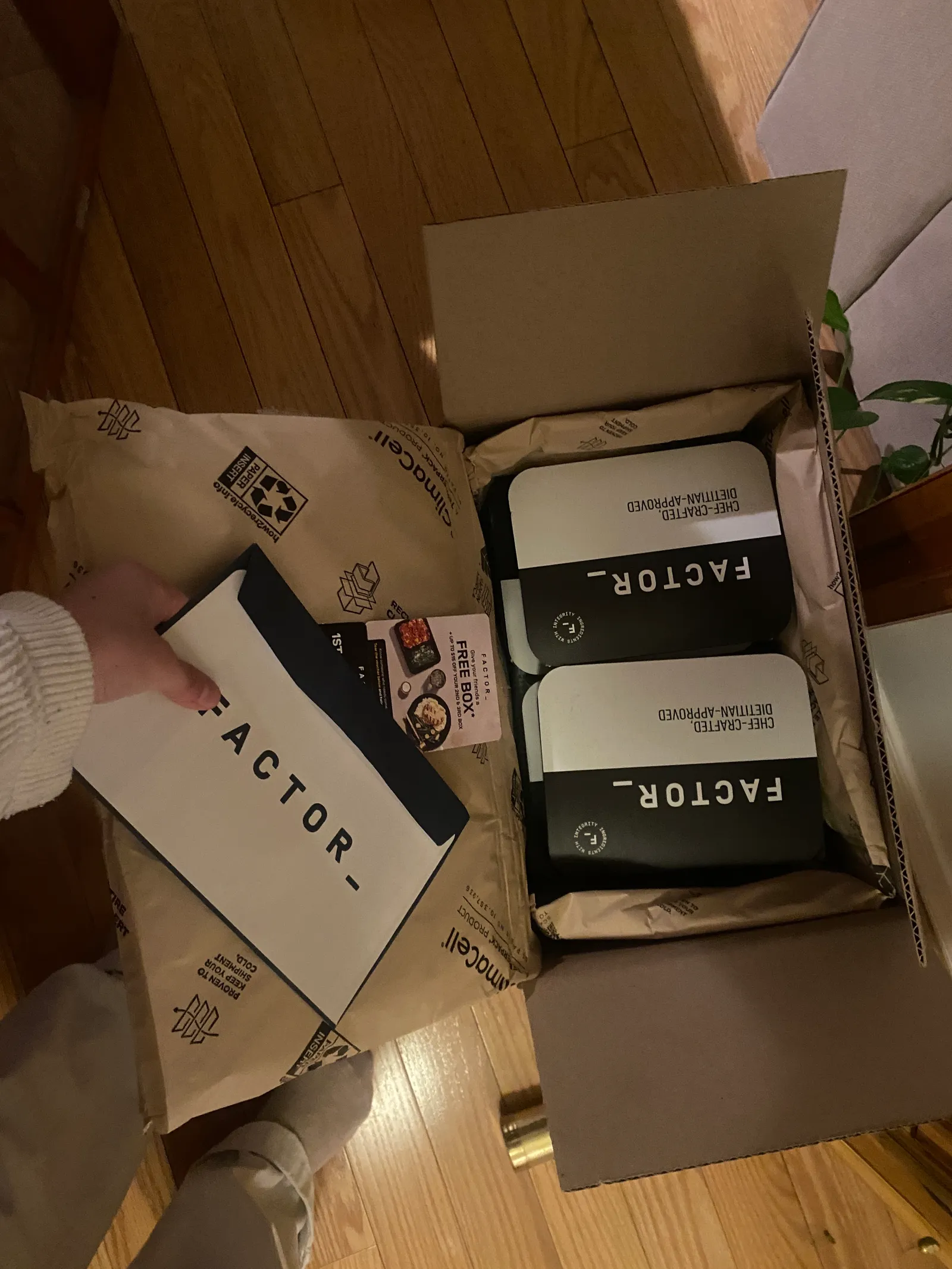 Image may contain Text Number Symbol Box Baby and Person